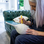 Rhian Malin decorating a mandala bottle in her workshop 2019